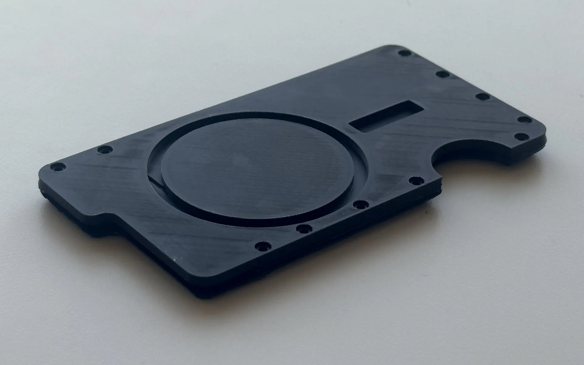 Prototype 2, 3D printed all in black, phone side up.